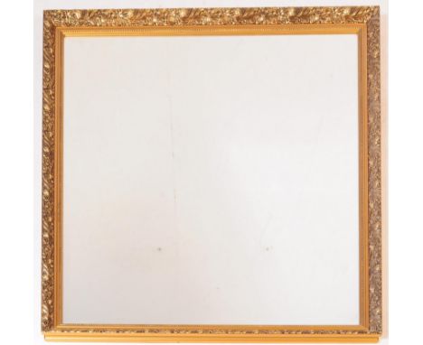 A vintage 20th century gilt large over mantel mirror. Rectangular form with bevelled edge with gilt floral repeating frame wi