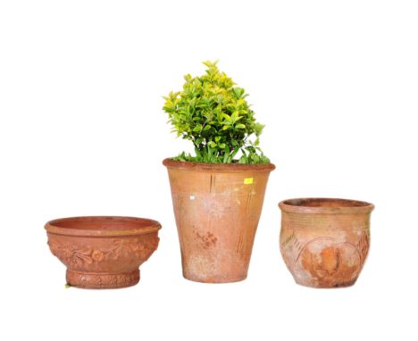 A collection of three vintage 20th century terracotta ceramic pottery planter plant pots. Of circular form with curved rim wi