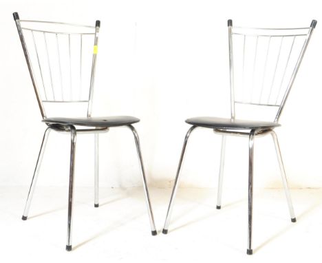 A pair of vintage retro mid 20th Century 1960 French chrome metal dining chairs by Soudex. The chrome framed chairs having bl