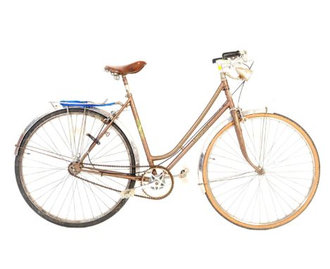 A vintage 20th century circa 1940s Peugeot French ladies push bike / bicycle. With MF Manufrance ladies leather seat with ren