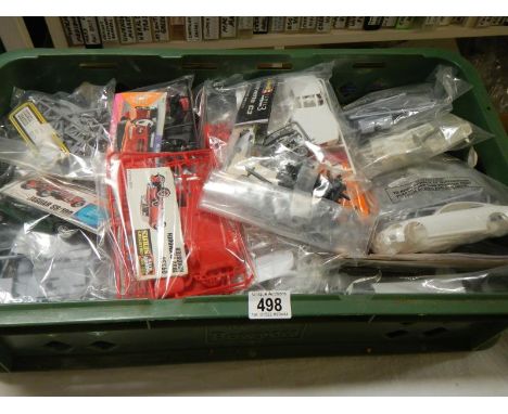 Approximately 28 plastic car model kits. No boxes or instructions, unchecked