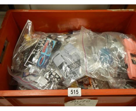 30 Plastic model kits including Polar lights Batmobile, Airfix triumph herald etc. No boxes or instructions, unchecked