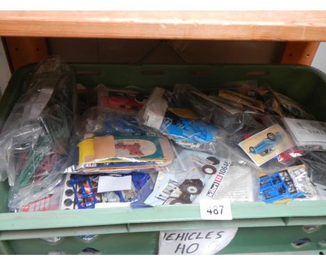 Approximately 30 plastic model kits of commercial vehicles and cars. Unboxed, no instructions, unchecked