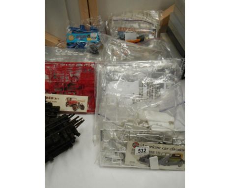 13 plastic model car kits including Airfix, Heller. No boxes or instructions and unchecked for completeness