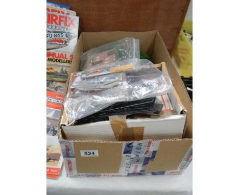 A box of model railway layout, trees, buildings and other accessories