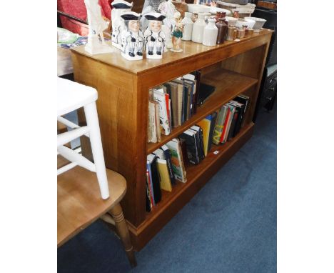 A LIGHT OAK BOOKCASE OF CONTEMPORARY DESIGN, 34" high x 53.25" wide