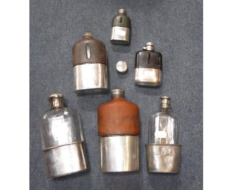 A SMALL COLLECTION OF HIP-FLASKS including a leather mounted flask