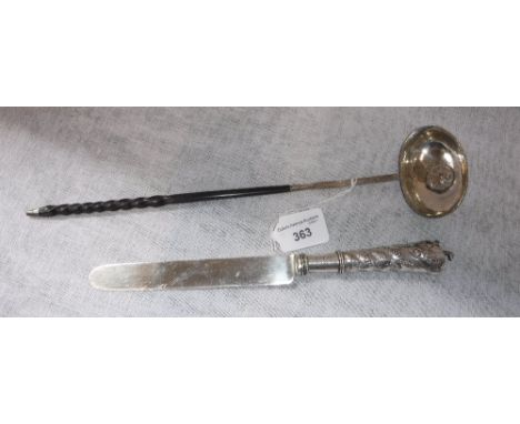 A GEORGE III SILVER TODDY LADLE inset with a coin dated 1780 with whalebone twist handle and a silver handled and bladed cake