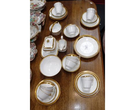 A COLLECTION OF 19TH CENTURY WHITE AND GILT BANDED TEAWARE, including a handled sucrier 