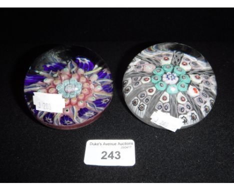 TWO GLASS PAPERWEIGHTS one with radiating and spiral canes and a 'S' cane