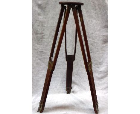 A VINTAGE MAHOGANY PHOTOGRAPHER'S TRIPOD, with brass fittings, stamped ' CROWN TRIPOD No 4, Folmer Graflex Corp Rochester NY 