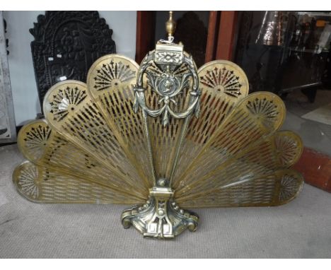 A BRASS FAN FIREGUARD