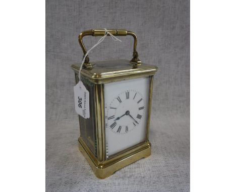 A BRASS-CASED CARRIAGE CLOCK