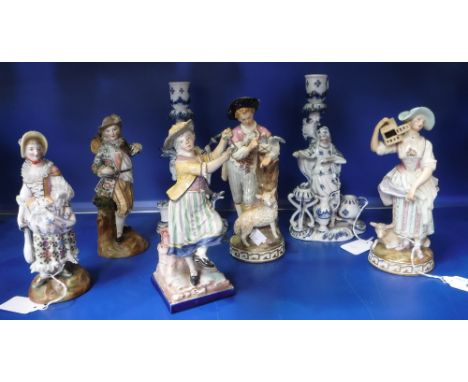 A COLLECTION OF CERAMIC FIGURES including a woman playing a triangle and others