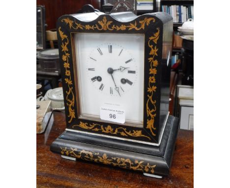 A 19TH CENTURY FRENCH MANTEL CLOCK in an ebonised and marquetry case, the enamel dial inscribed 'Thomas a Paris' (pendulum in