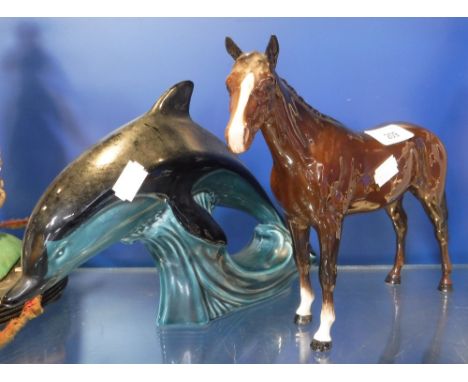 A POOLE POTTERY DOLPHIN and a Beswick horse