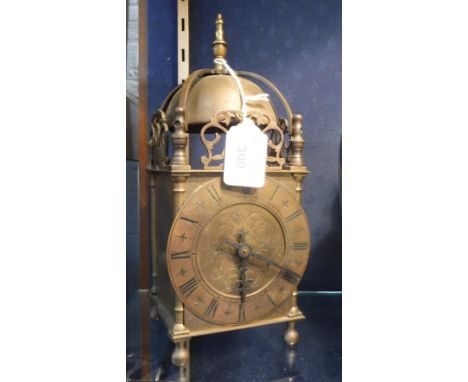 A LANTERN STYLE MANTEL CLOCK