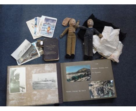 A VINTAGE POSTCARD ALBUM, two cloth dolls and two Norah Wellings Army and Navy type dolls