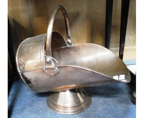 A VICTORIAN COPPER HELMET COAL SCUTTLE