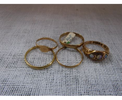 A THREE STONE OPAL GYPSY RING and a collection of other gold rings