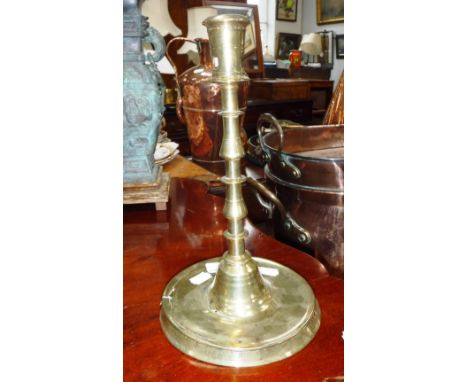 A LATE 17TH/EARLY 18TH CENTURY BRASS CANDLESTICK 
