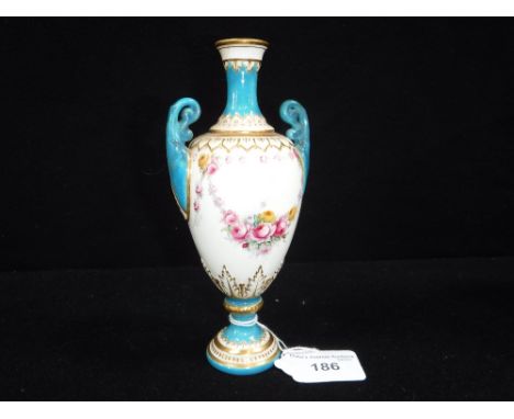 A ROYAL WORCESTER VASE with turquoise glazed handles and neck, with painted floral decoration