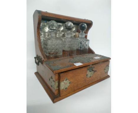 A 19th century Tantalus with fitted 3 section decanter set [34x36X26.5cm] 