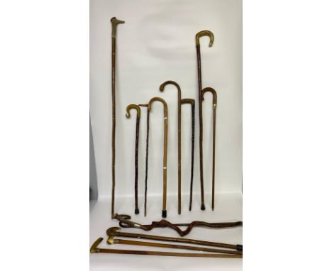 A collection of antique shepherds crooks &amp; walking sticks; 18ct gold plated mounted walking stick, 2 shepherds crooks &am