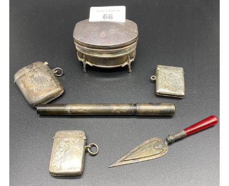 A Selection of silver items; Three silver vesta cases, Small Birmingham silver four foot jewel box, Silver trowel paper clip 