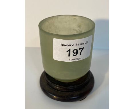 A Chinese Pale green Hetian Jade tea cup supported on stand [7.5cm] 