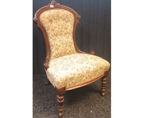 Antique button back parlour chair with turned legs and castor feet. 