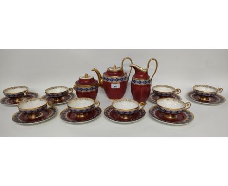 A Victorian french Serves red back ground tea service set in flower design; cups, plates &amp; tea pot &amp; sugar dish 