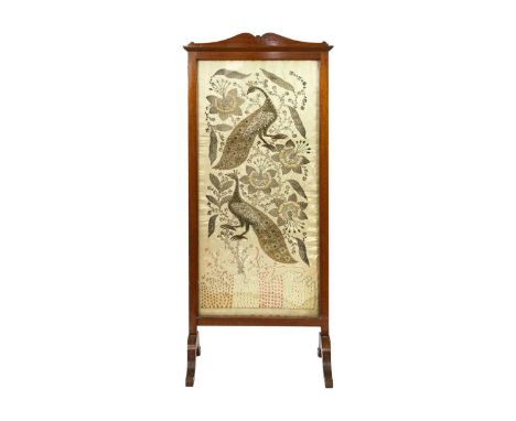 An Indian silk and metal thread panel, 19th century. In an Edwardian mahogany firescreen frame, height 141cm, width 59cm.