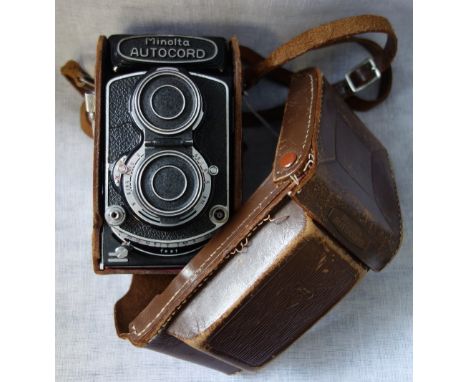 A VINTAGE MINOLTA AUTOCORD CHIYOKO CAMERA in a brown leather case