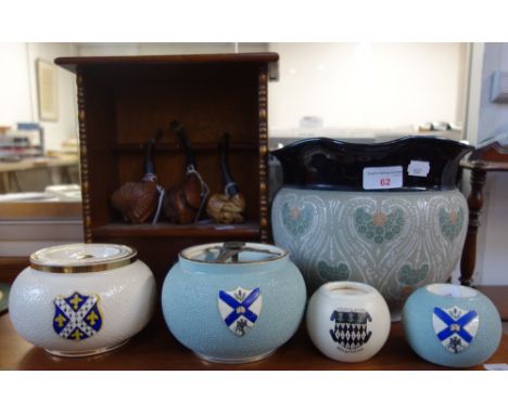 A CARLTONWARE TOBACCO JAR, with college armorial, a matching striker, three other armorial smoking items, three carved pipes,