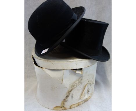 A VINTAGE BLACK TOP HAT and a similar bowler hat,