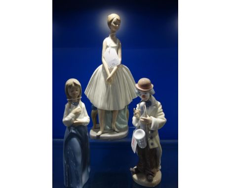 A LLADRO FIGURE OF A TRAMP SAXOPHONIST, a Nao figure of a ballerina and another Nao figure