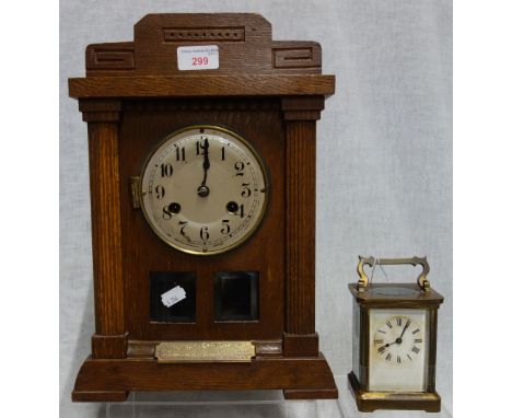 AN EARLY 20TH CENTURY BRASS CASED CARRIAGE CLOCK, and an oak cased mantel clock (2)