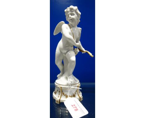 AN ITALIAN WHITE GLAZED CERAMIC STUDY OF EROS with overlaid gilt decoration, marked, 'N' to the base, 20cm high