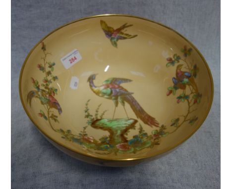 A SPODE BOWL decorated with brightly decorated tropical birds on an apricot ground, 26cm dia.