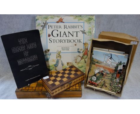 A PETER RABBIT BOOK and a collection of Vintage games
