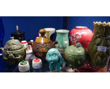 A COLLECTION OF CERAMIC KITCHEN JARS with faces and similar items