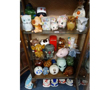 A COLLECTION OF VINTAGE NOVELTY MONEY BOXES, including 'Dusty Bin'