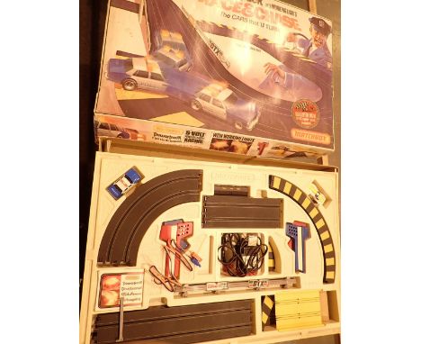 Matchbox Race and Chase motor racing set including one car and one Police car with flashing light track controllers etc