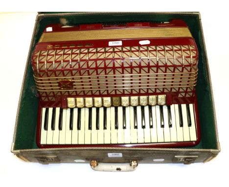 Hohner Atlantic IV De Luxe Accordion 120 bass buttons with 3 registers and 41 piano keys with 11 registers; in red and gold i