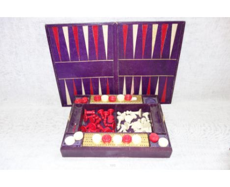 A CHESS, DRAUGHTS AND BACKGAMMON SET, in a part fitted box, with bezique slides