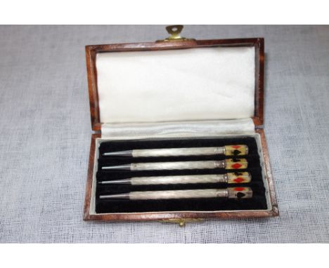 FOUR WHITE METAL ENGINE TURNED BRIDGE PENCILS, in a fitted leatherette case