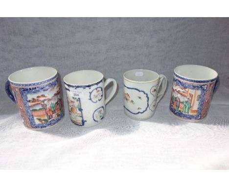 TWO CHINESE MANDARIN PALLETTE MUGS, painted with figures on waterside terraces, 14 cm and 13 cm high, two famille mugs, one w