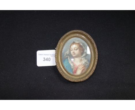 A 19TH CENTURY MINIATURE DEVOTIONAL PORTRAIT, head and shoulders, possibly painted on parchment