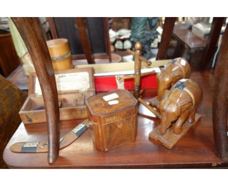 A REGENCY ROSEWOOD TEA CADDY, a pair of carved wooden elephants and sundries